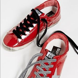 Patent leather Golden Goose sneakers.